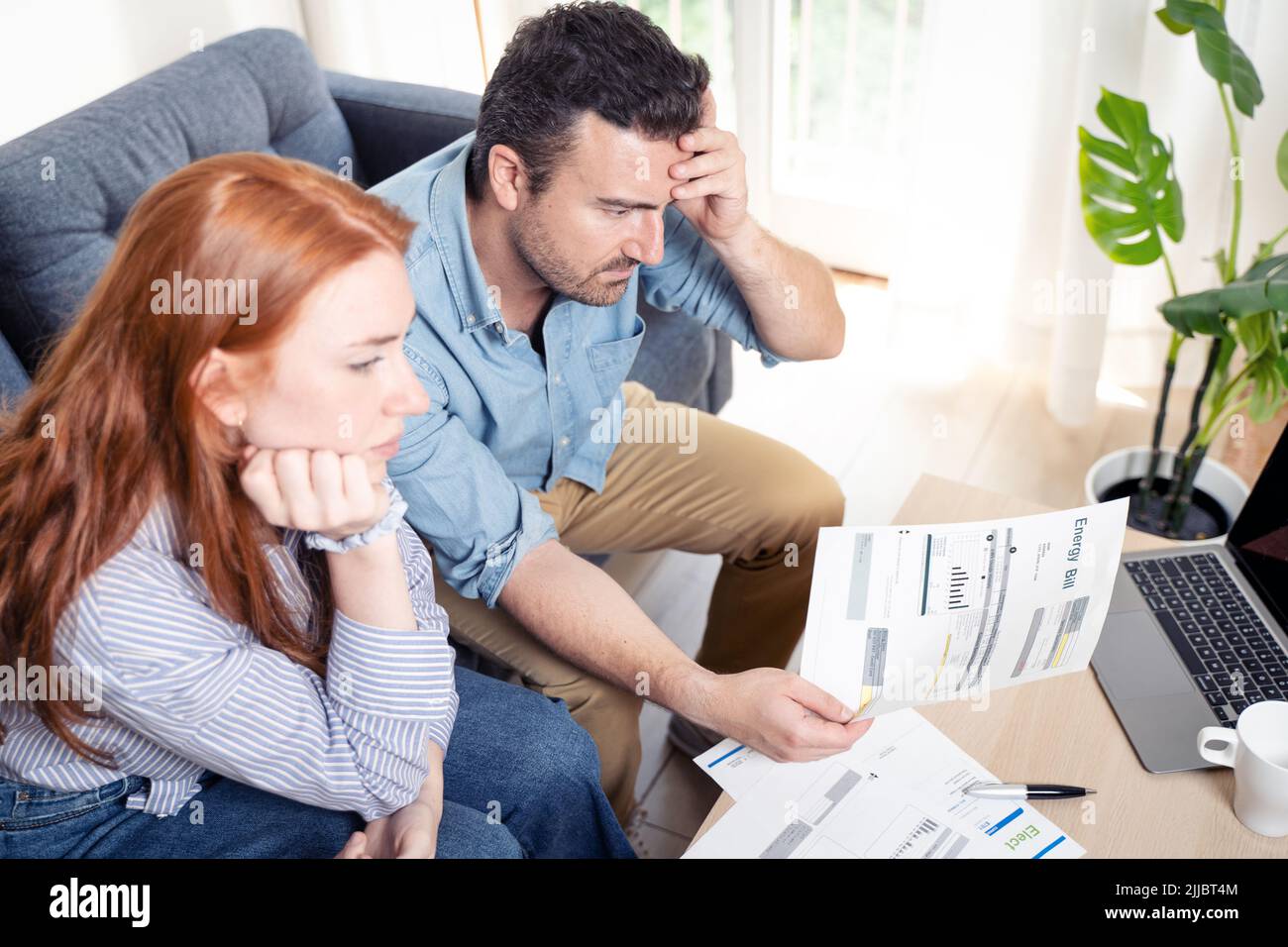 Couple managing the debt unable to pay out loans Stock Photo