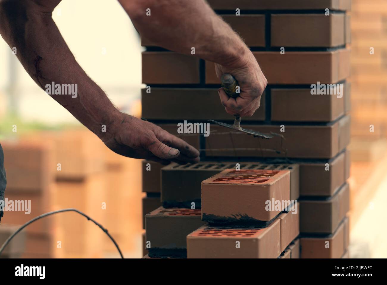 Worker Or Bricklayer Works With Trowel Laying Bricks Builder Makes