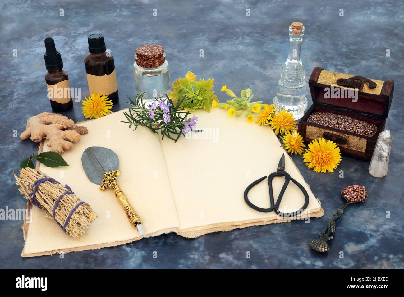 Pagan natural healing cleansing herbal plant medicine. Herbs and flowers for alternative naturopathic remedies. Purifying sage smudge stick, notebook, Stock Photo