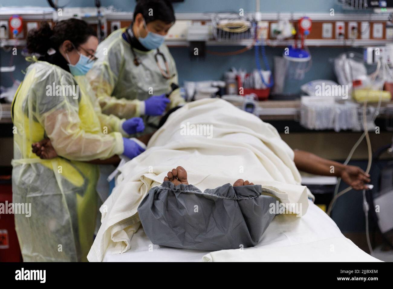 Doctors work on an injured border wall fall patient after she arrived by ambulance at Scripps Mercy Hospital’s trauma unit in San Diego, California, U.S., May 25, 2022. REUTERS/Mike Blake Stock Photo