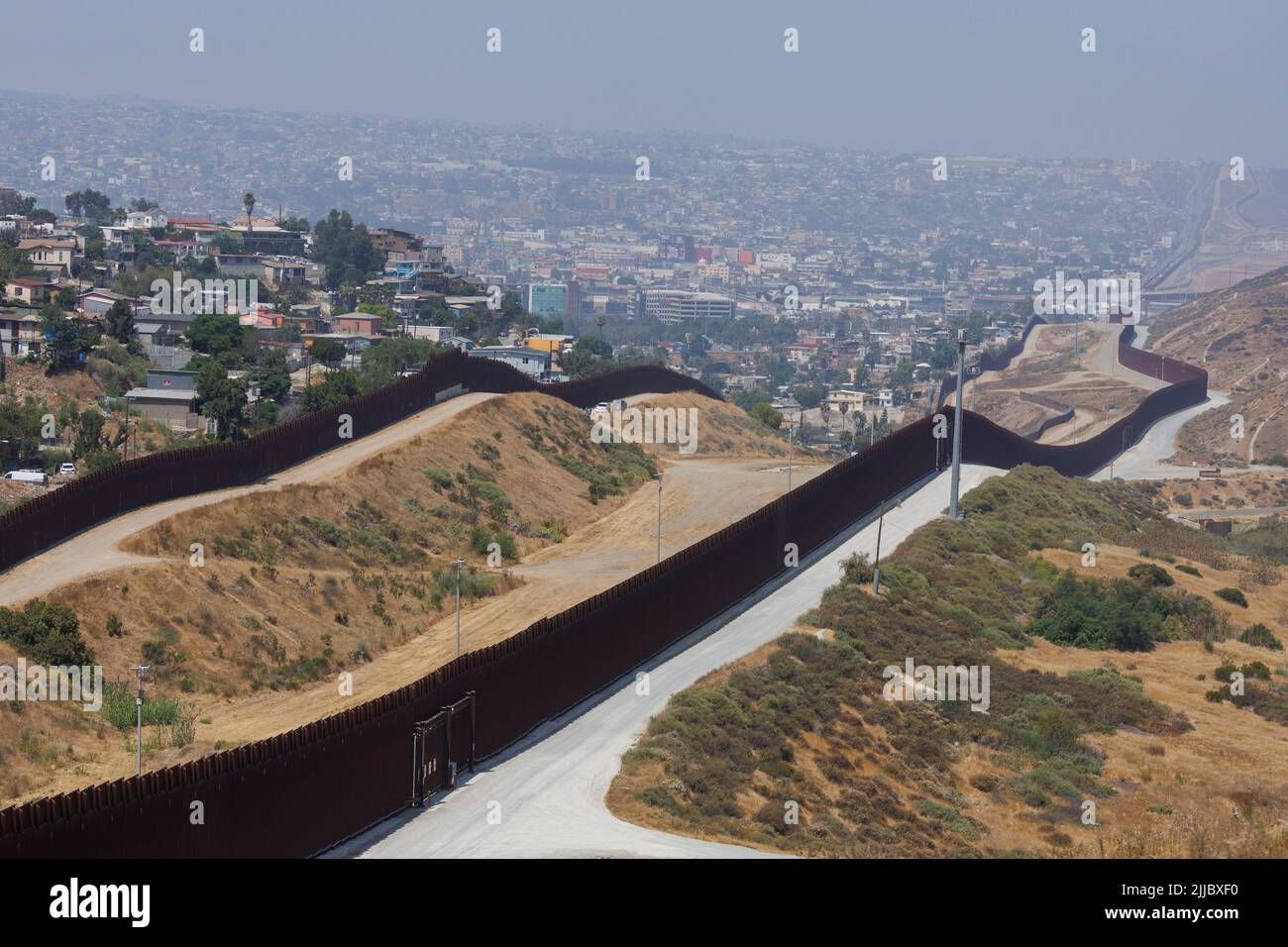 The border wall between Mexico and the United States is seen in San Diego, California, U.S., June 9, 2022. REUTERS/Mike Blake Stock Photo