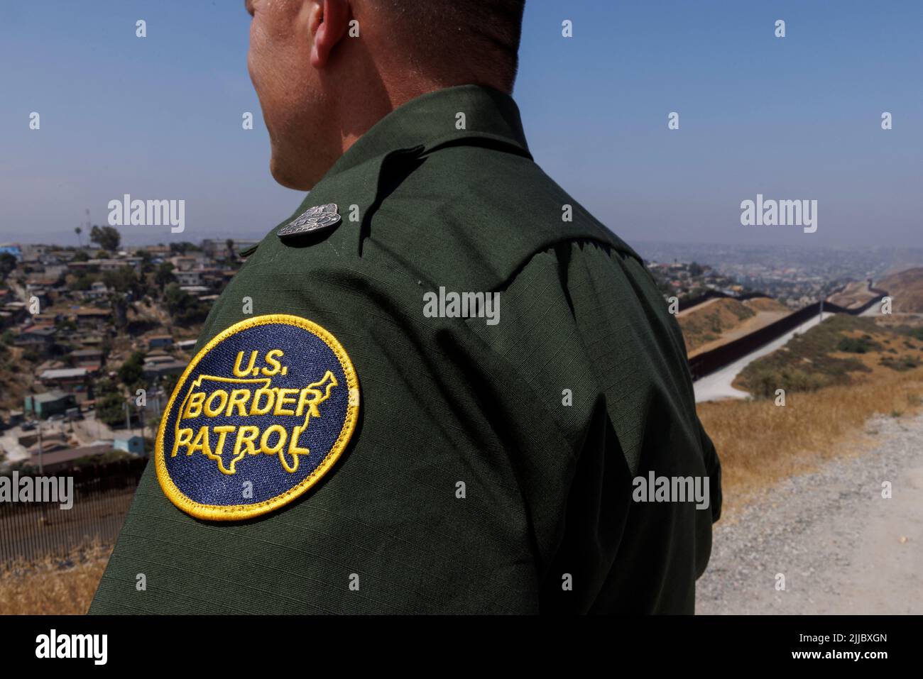 U.S. Customs and border patrol officer Brent Schwerdtfeger, Division Chief of Operations for San Diego Sector looks out from along the secondary 30 foot border wall between Mexico and the United States in San Diego, Californian, U.S., June 9, 2022.  REUTERS/Mike Blake Stock Photo