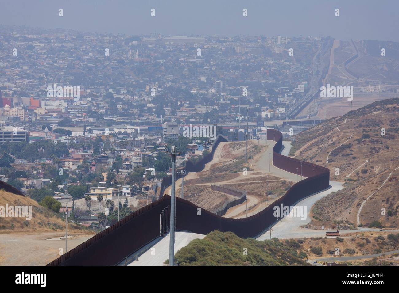 The primary and secondary border walls between the United States and Mexico are shown along the San Diego sector with Tijuana, Mexico in the background looking south west from San Diego, Californian, U.S., June 9, 2022. REUTERS/Mike Blake Stock Photo