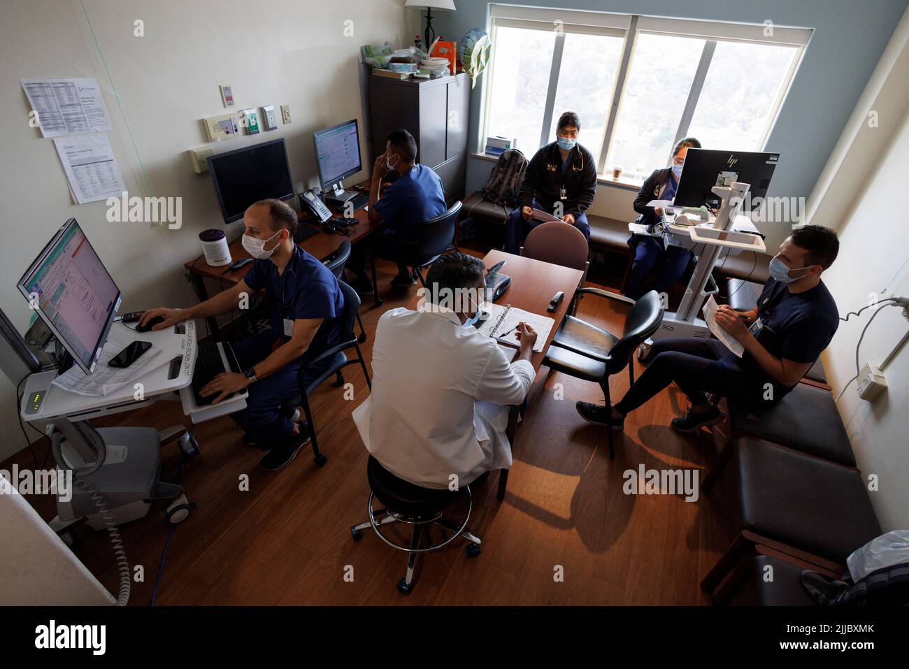 Dr. Vishal Bansal, head of the trauma unit at Scripps Mercy Hospital, meets with his resident doctors before morning rounds in San Diego, California, U.S. May 20, 2022. REUTERS/ Mike Blake Stock Photo