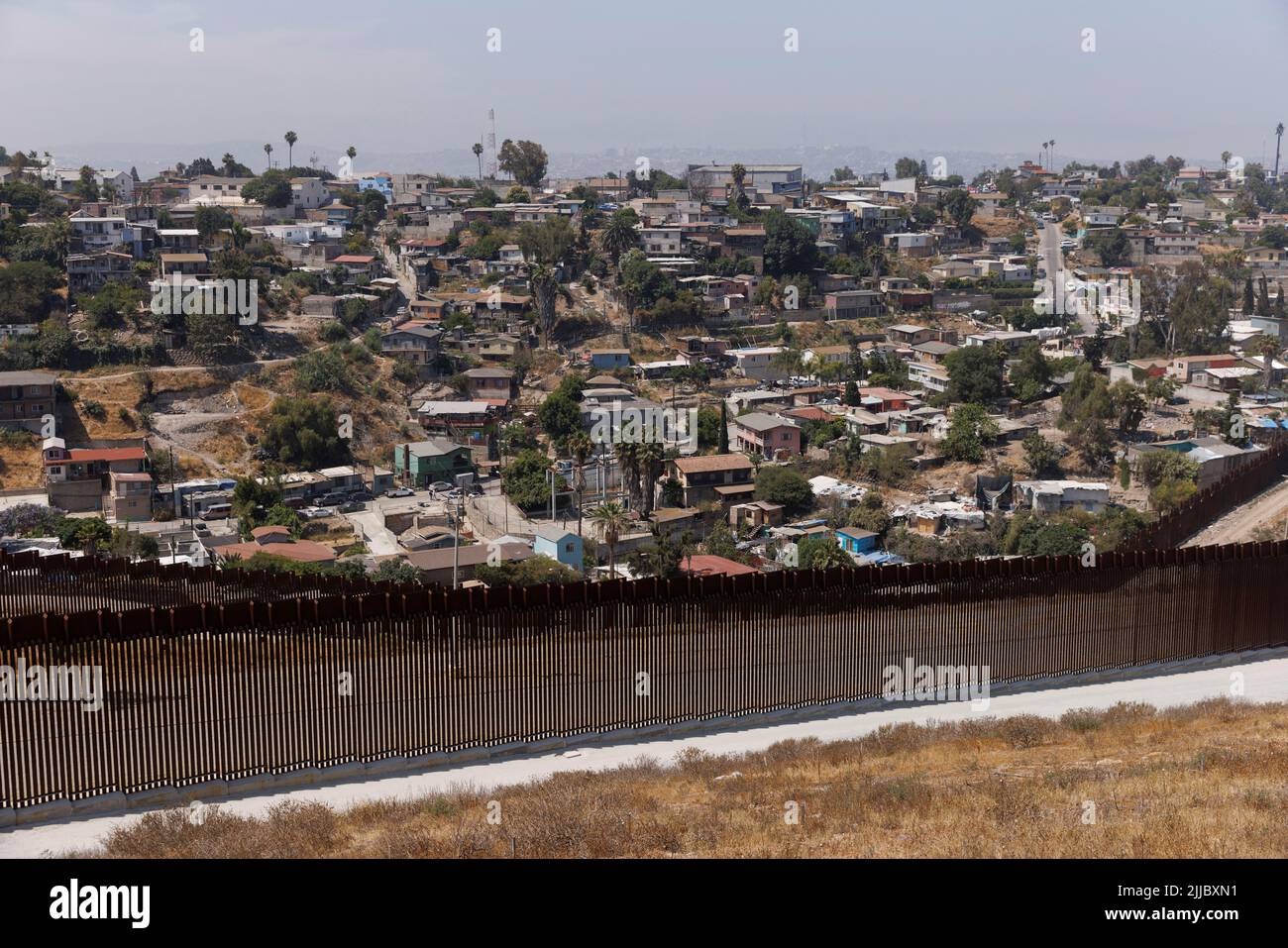 The primary and secondary border walls between the United States and Mexico are shown along the San Diego sector with Tijuana, Mexico in the background looking south west from San Diego, California, U.S., June 9, 2022.  REUTERS/Mike Blake Stock Photo