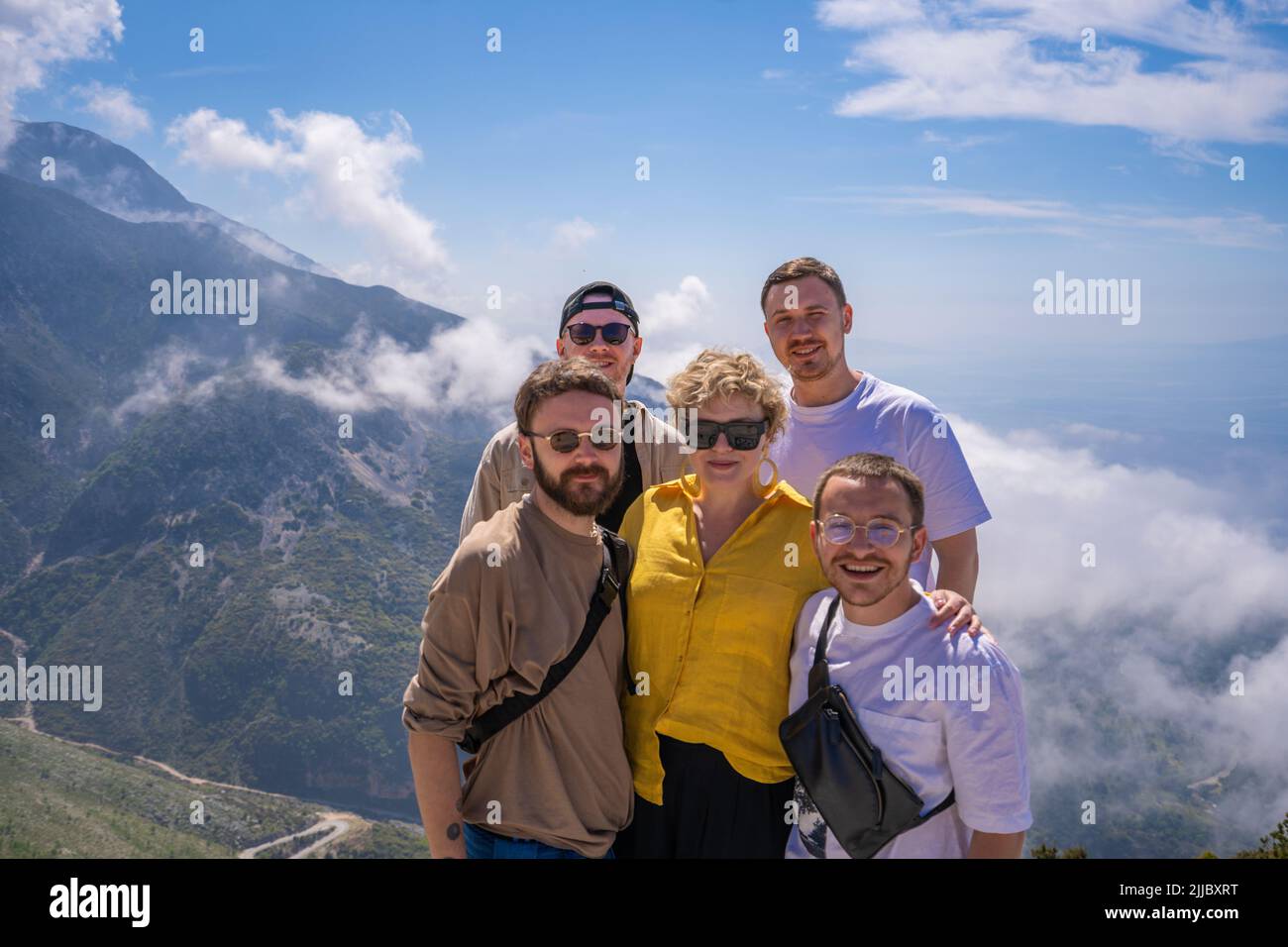 Young couple standing on a mountain top hi-res stock photography and ...