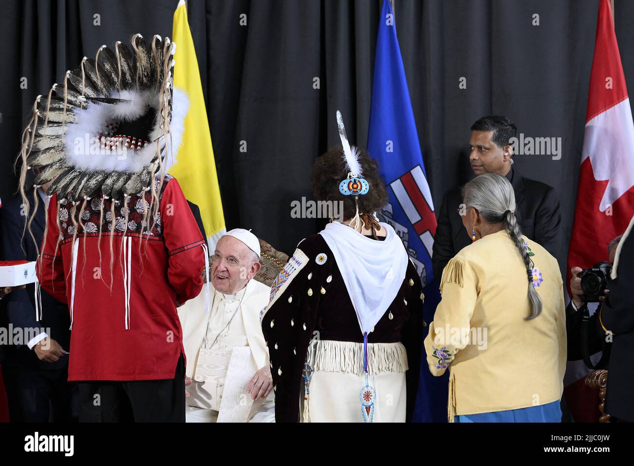 Edmonton, Canada. 24th July, 2022. Pope Francis meets George Arcand (left), Grand Chief of the Confederacy of Treaty Six First Nations, and residential school survivors Elder Vicki Arcand (centre) and Elder Alma Desjarlais (right) during his welcoming ceremony at Edmonton International Airport, AB, western Canada on July 24, 2022 for his six-day papal visit across Canada. Pope's visit to Canada is aimed at reconciliation with Indigenous people for the Catholic Church's role in residential schools. Photo by Vatican Media (EV)/ABACAPRESS.COM Credit: Abaca Press/Alamy Live News Stock Photo