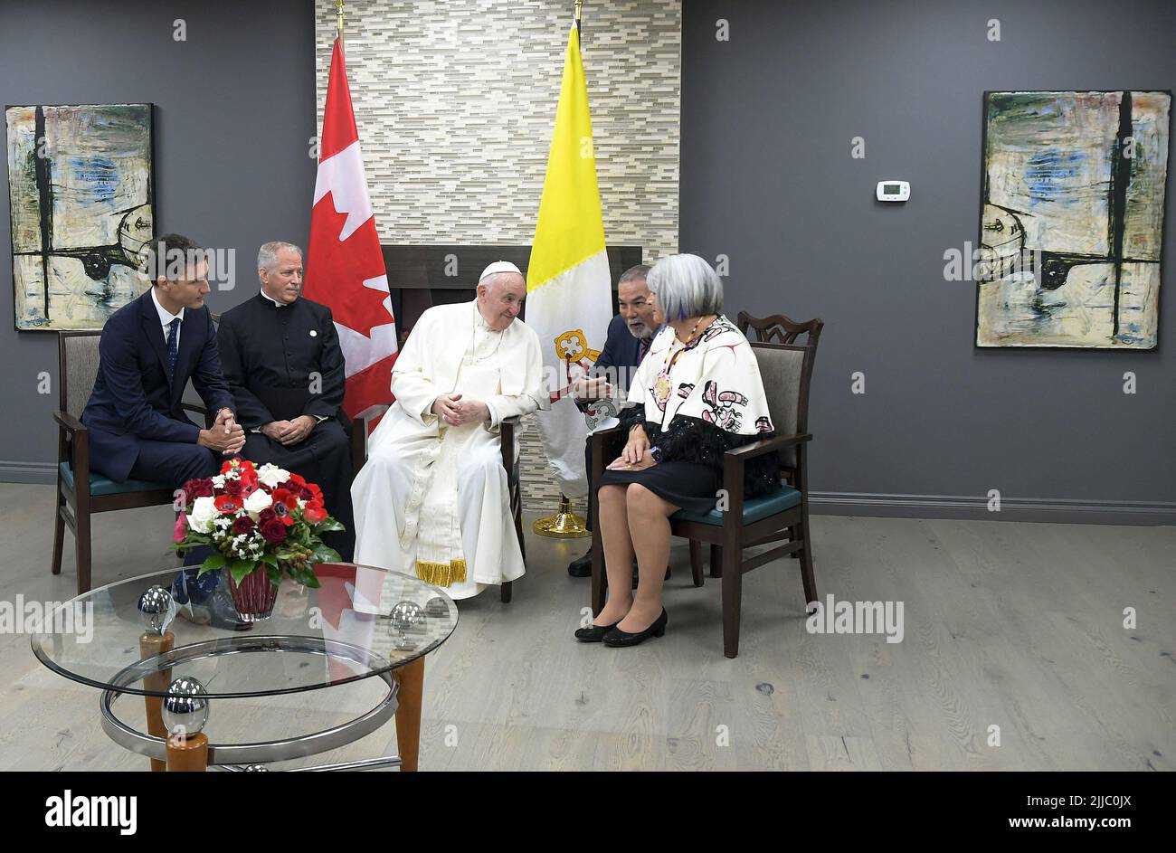 Edmonton, Canada. 24th July, 2022. Francis meets Canada's Prime Minister Justin Trudeau (left) and members of the First Nations during his welcoming ceremony at Edmonton International Airport, AB, western Canada on July 24, 2022. Pope's visit to Canada is aimed at reconciliation with Indigenous people for the Catholic Church's role in residential schools. Photo by Vatican Media (EV)/ABACAPRESS.COM Credit: Abaca Press/Alamy Live News Stock Photo