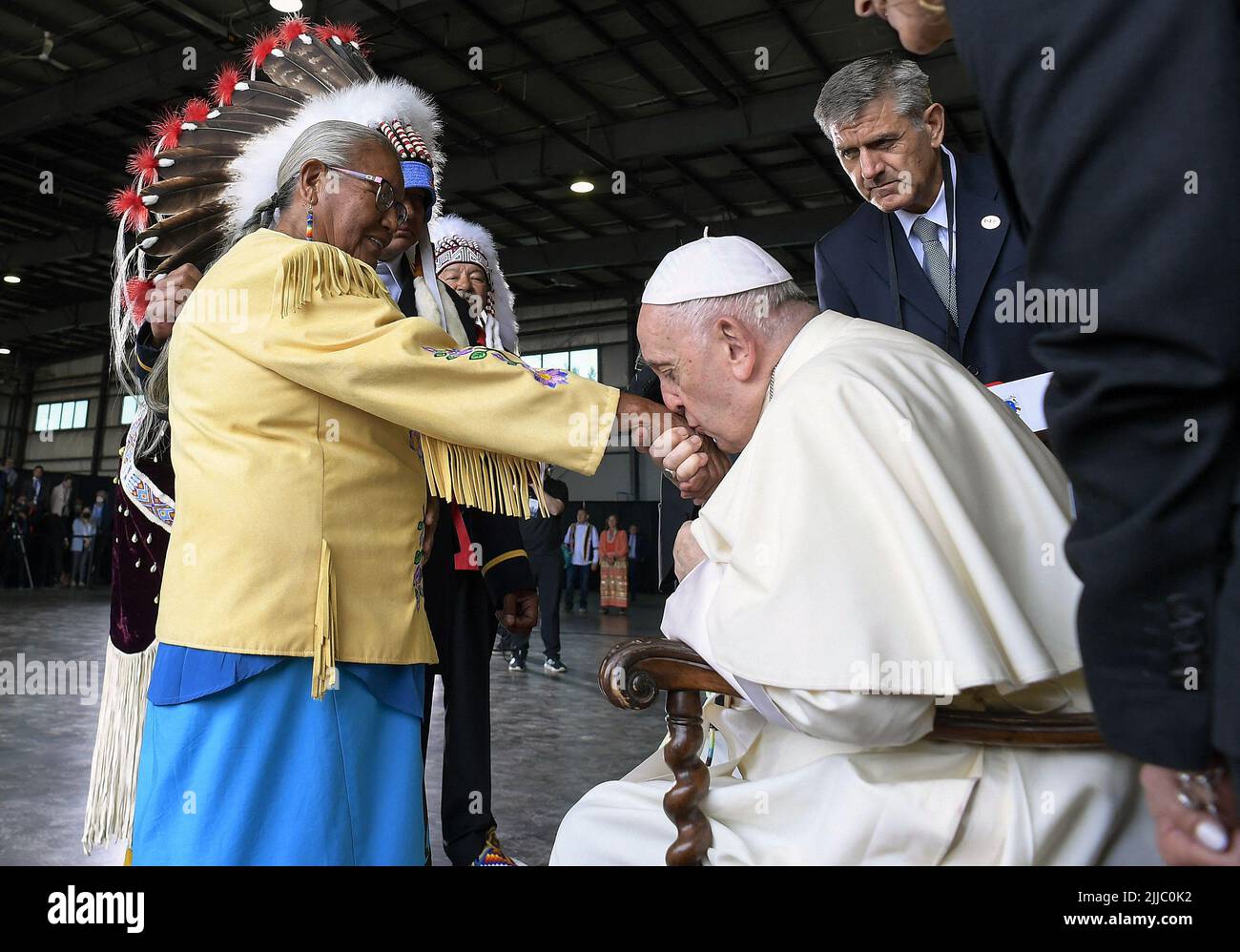 Edmonton, Canada. 24th July, 2022. Pope Francis kisses the hand of residential school survivor Elder Alma Desjarlais of the Frog Lake First Nation during his welcoming ceremony at Edmonton International Airport, AB, western Canada on July 24, 2022 for his six-day papal visit across Canada. Pope's visit to Canada is aimed at reconciliation with Indigenous people for the Catholic Church's role in residential schools. Photo by Vatican Media (EV)/ABACAPRESS.COM Credit: Abaca Press/Alamy Live News Stock Photo