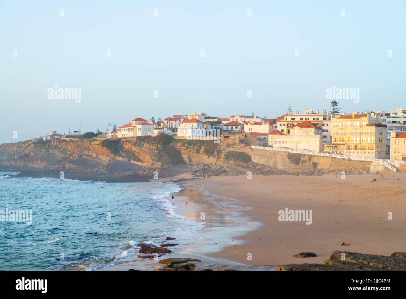 Praia das Macas Apple Beach in Colares, Portugal, on a stormy day before  sunset Small city on ocean shore Stock Photo - Alamy