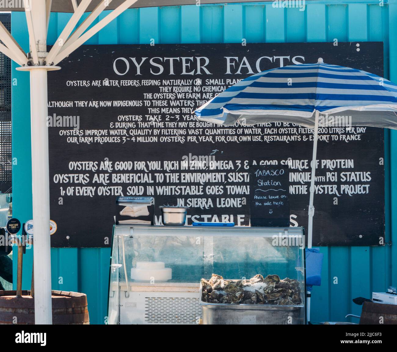 Whitstable, UK - July 16, 2022: Sign advertising the benefits of oysters at the Whitstable harbour market on a summer day Stock Photo