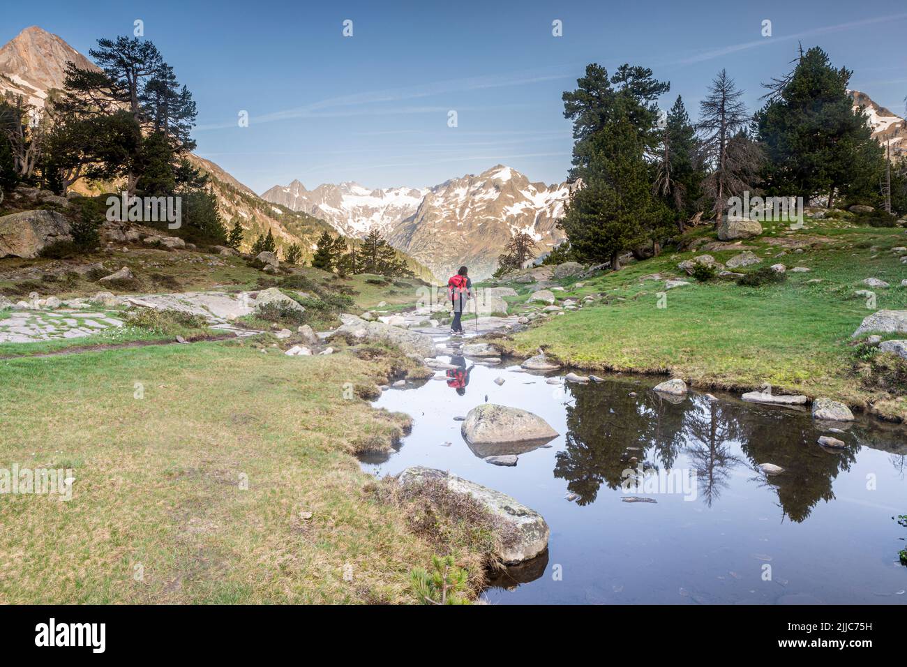 Hiking towards Plan de Aiguallut, Valle de Benasque, Natural Park of Posets-Maladeta, Huesca, Spain Stock Photo