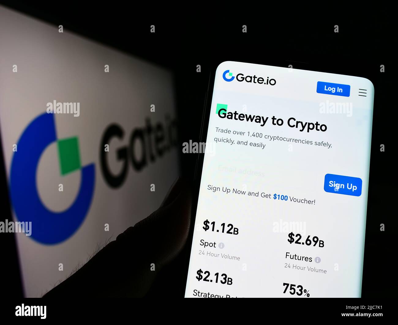 Gate.io is a cryptocurrency exchange. Gate.io logo on smartphone screen  against the background of the main cryptocurrencies Stock Photo - Alamy