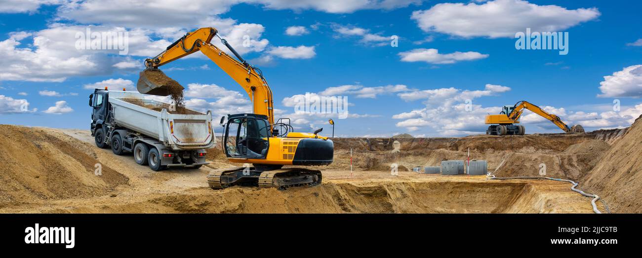 excavator is digging at construction site Stock Photo