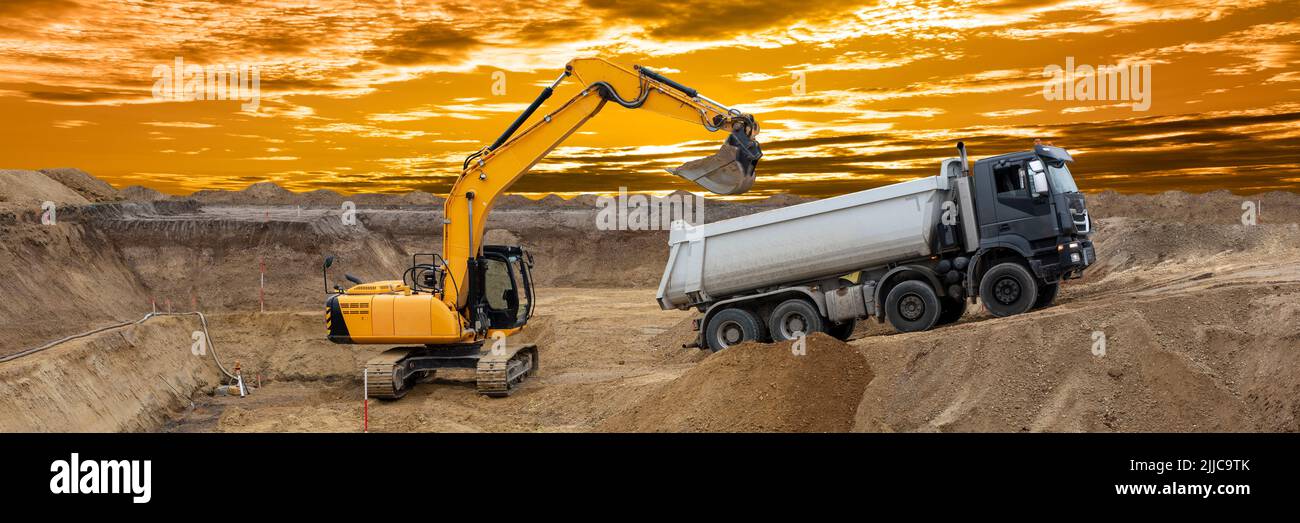 excavator is digging at construction site Stock Photo