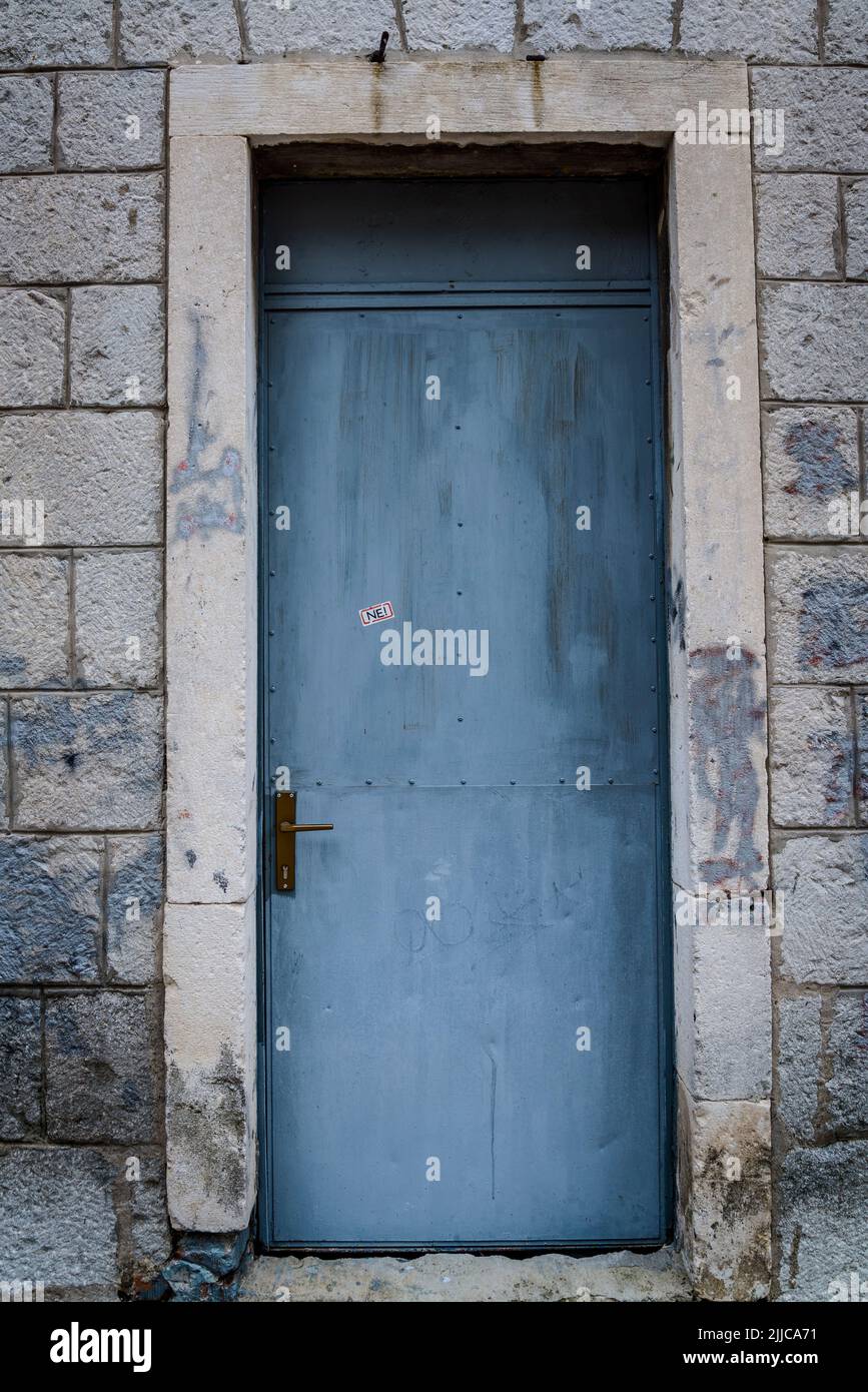 Blue door with 'No' sticker Stock Photo