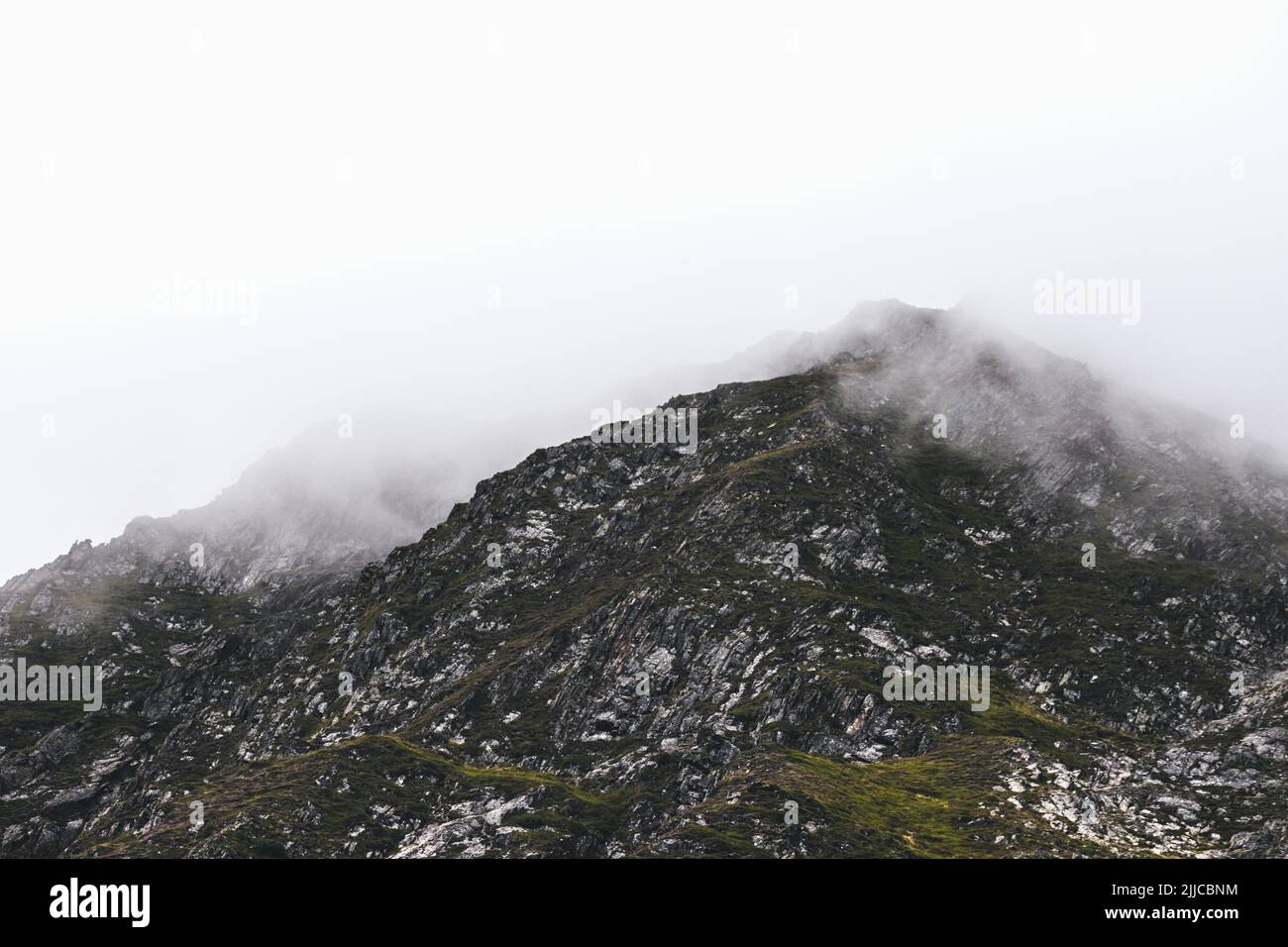 An aerial view of beautiful mountains on a foggy day Stock Photo - Alamy