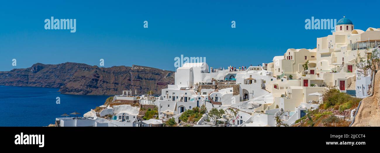 Beautiful panorama view of Oia with traditional white houses, Santorini island at the Aegean Sea, Greece Stock Photo