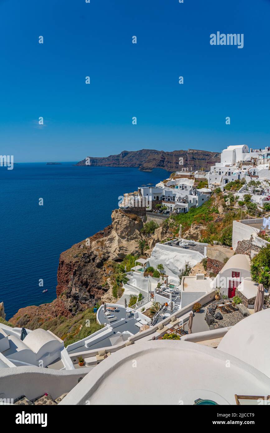 OIA, GREECE - MAY 22.2022: Beautiful view of Oia with traditional white houses, Santorini island, Greece, vertical Stock Photo