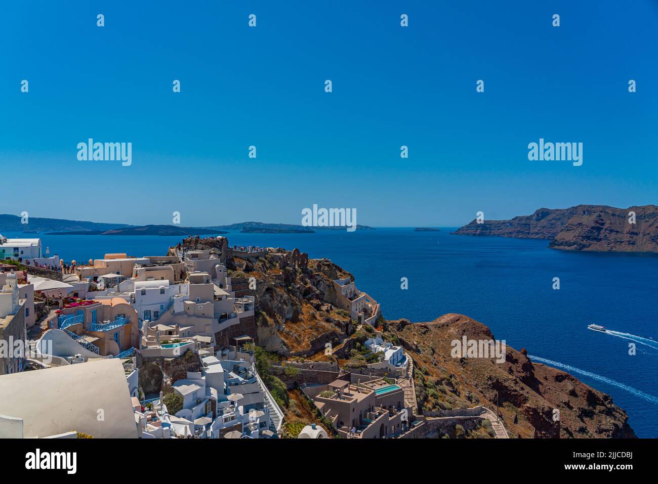 OIA, GREECE - MAY 22.2022: Beautiful view of Oia with traditional white houses, Santorini island, Greece Stock Photo