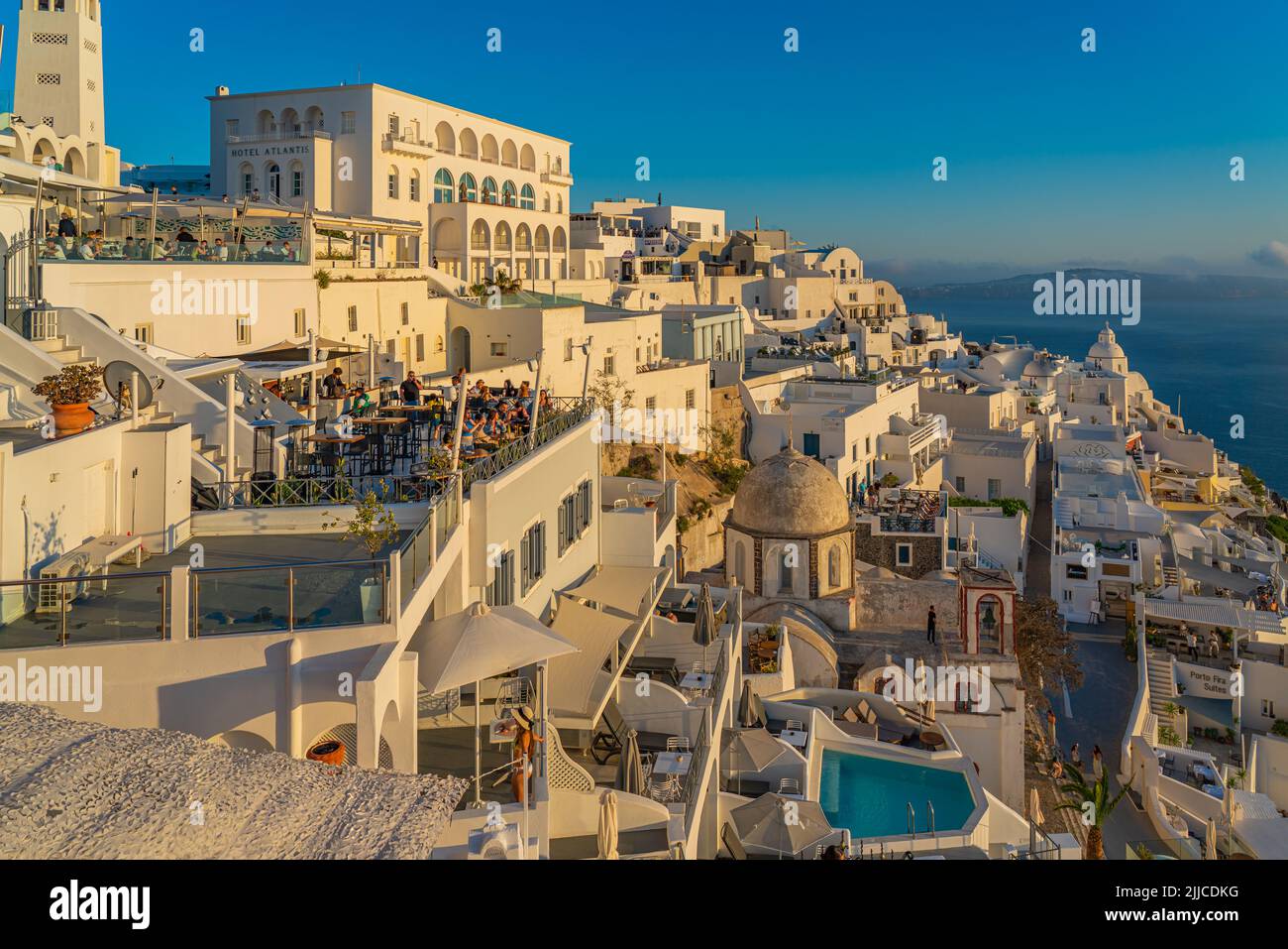 FIRA, GREECE - MAY 21.2022: White houses from Fira, the capital of Santorini island, background the sea Stock Photo