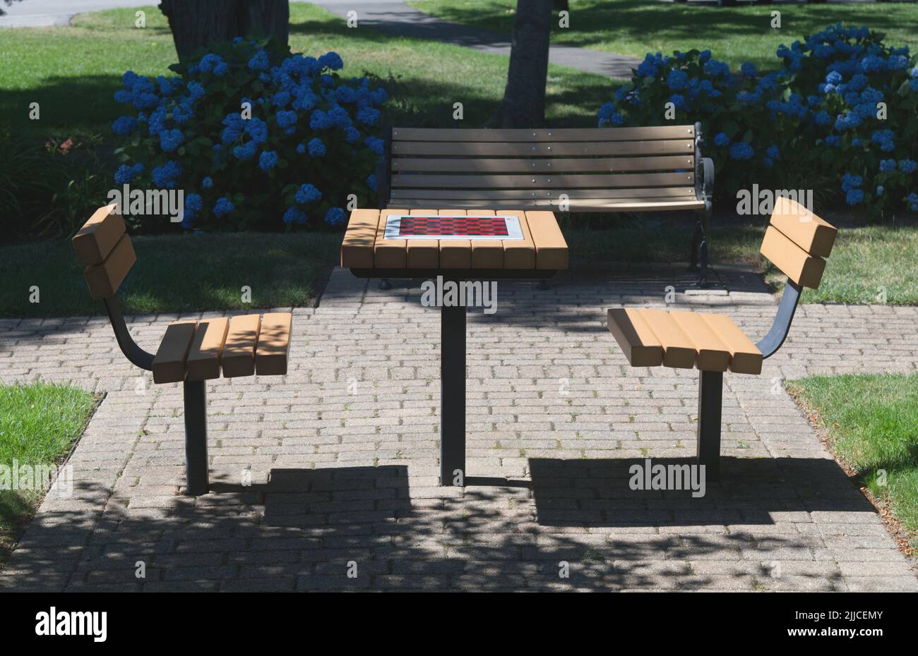 A table with a chess board in a park on Cape Cod, Massachusetts, USA Stock Photo