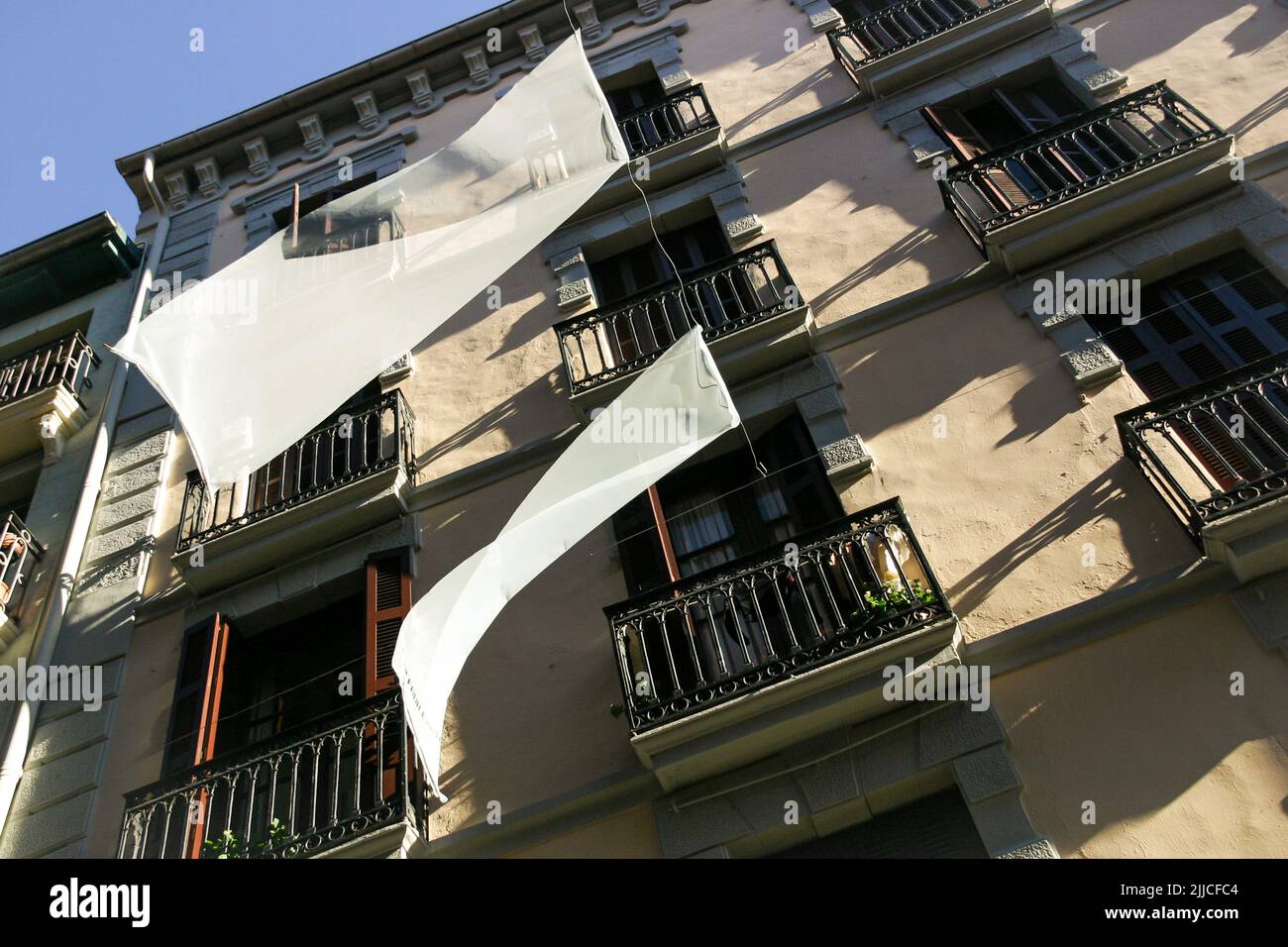 Shading sheets on a house facade in Pamplona Stock Photo