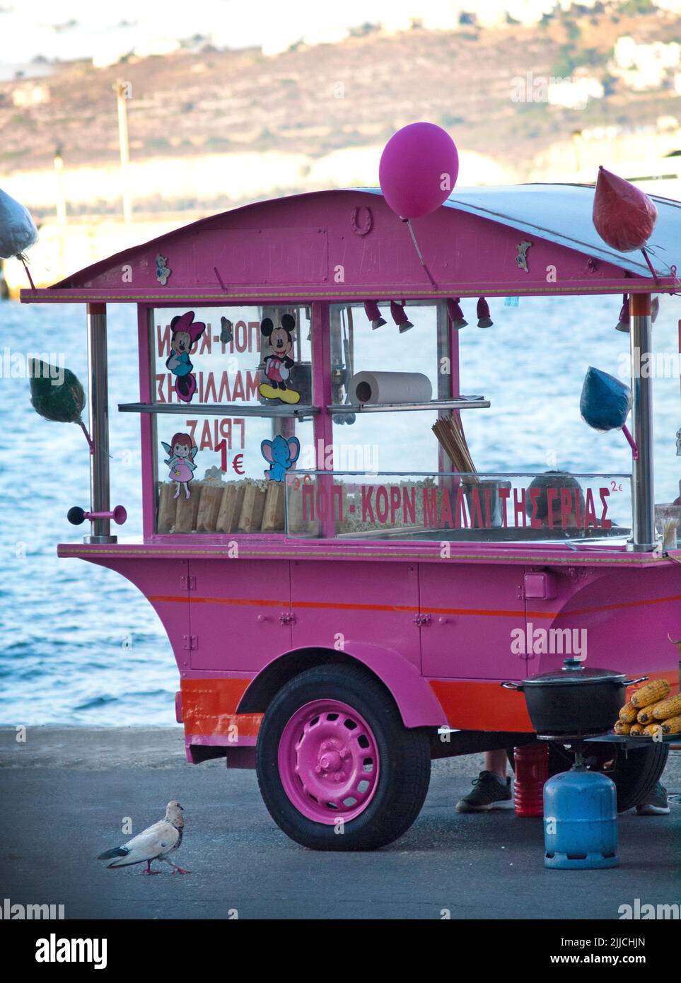 In Chania, Crete a pink food truck sells corn Stock Photo