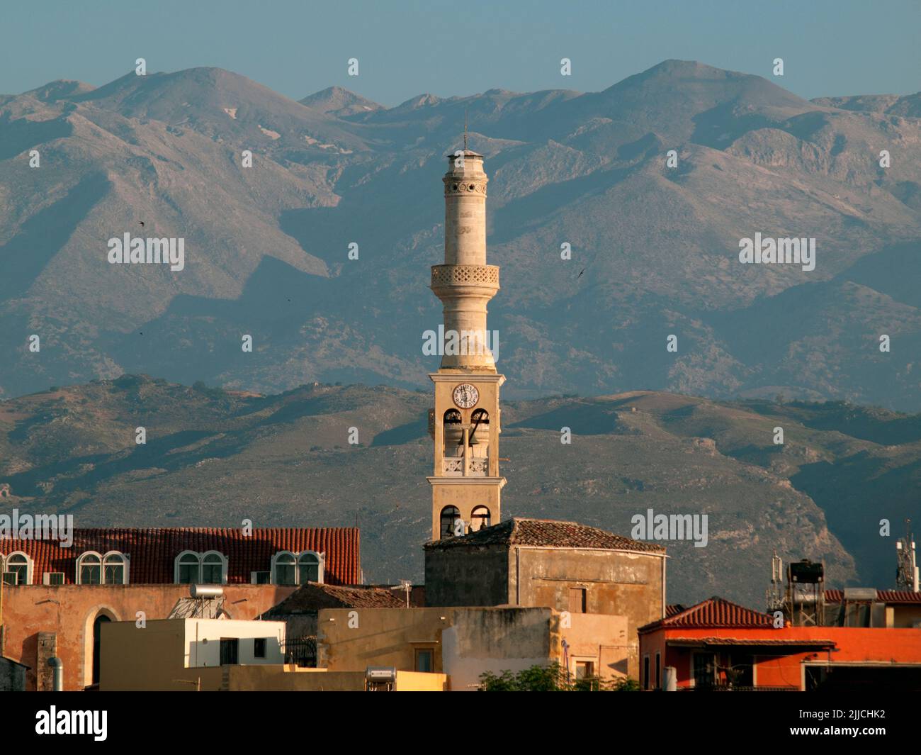 A minaret rises above the Cretan town of Chania Stock Photo