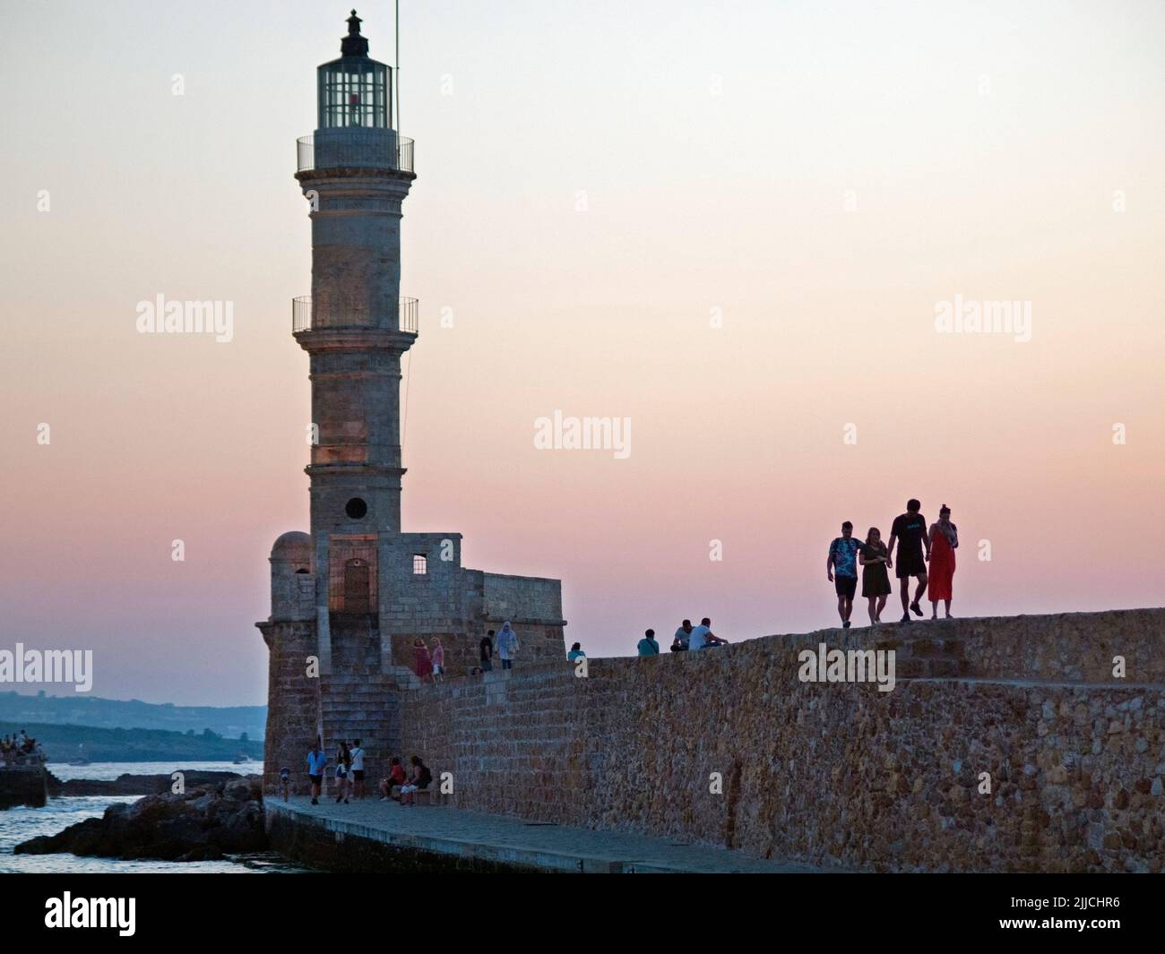 The lighthouse in the old Venetian harbour of Chania, Crete Stock Photo