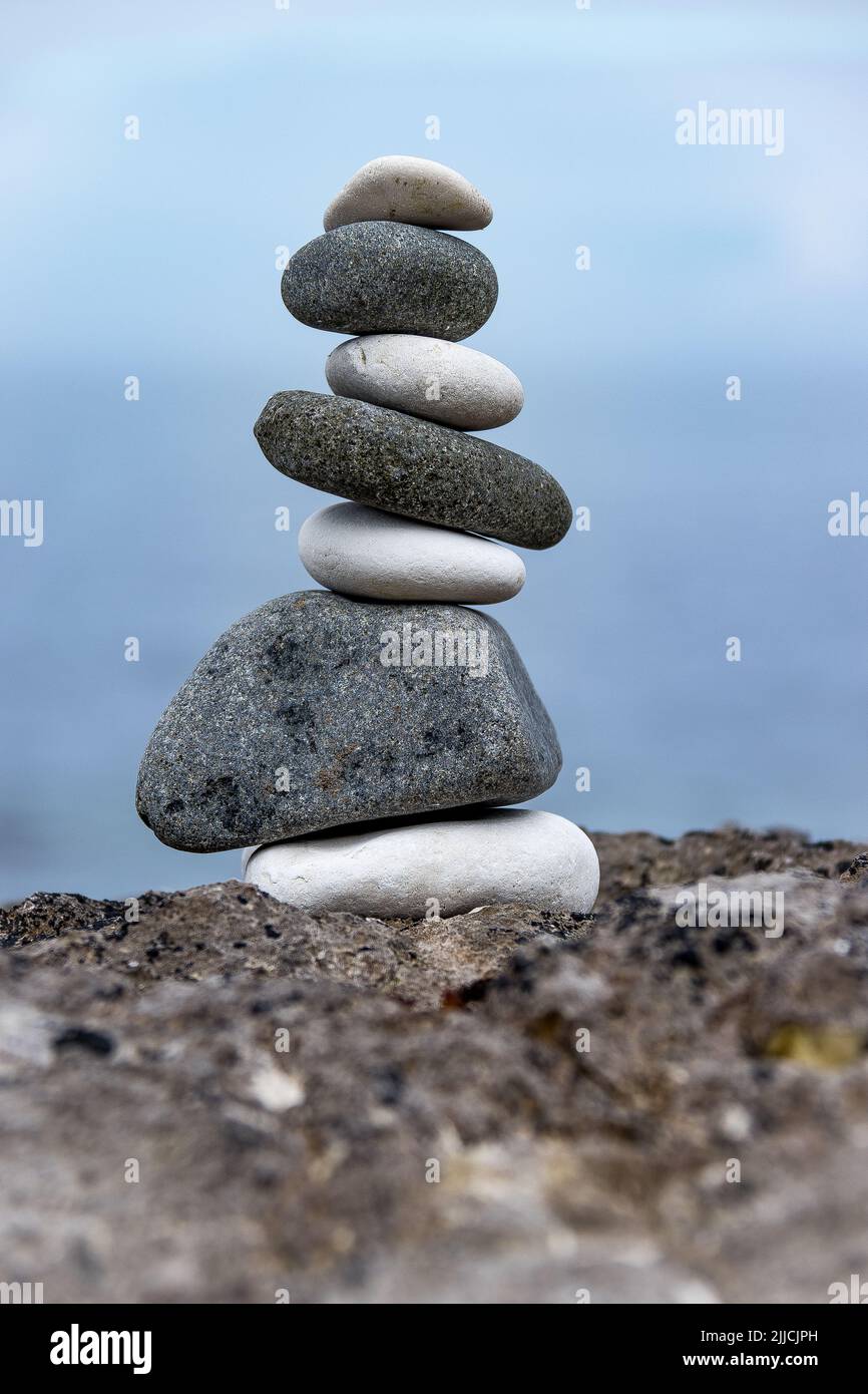 Stacked stones at the seaside Stock Photo