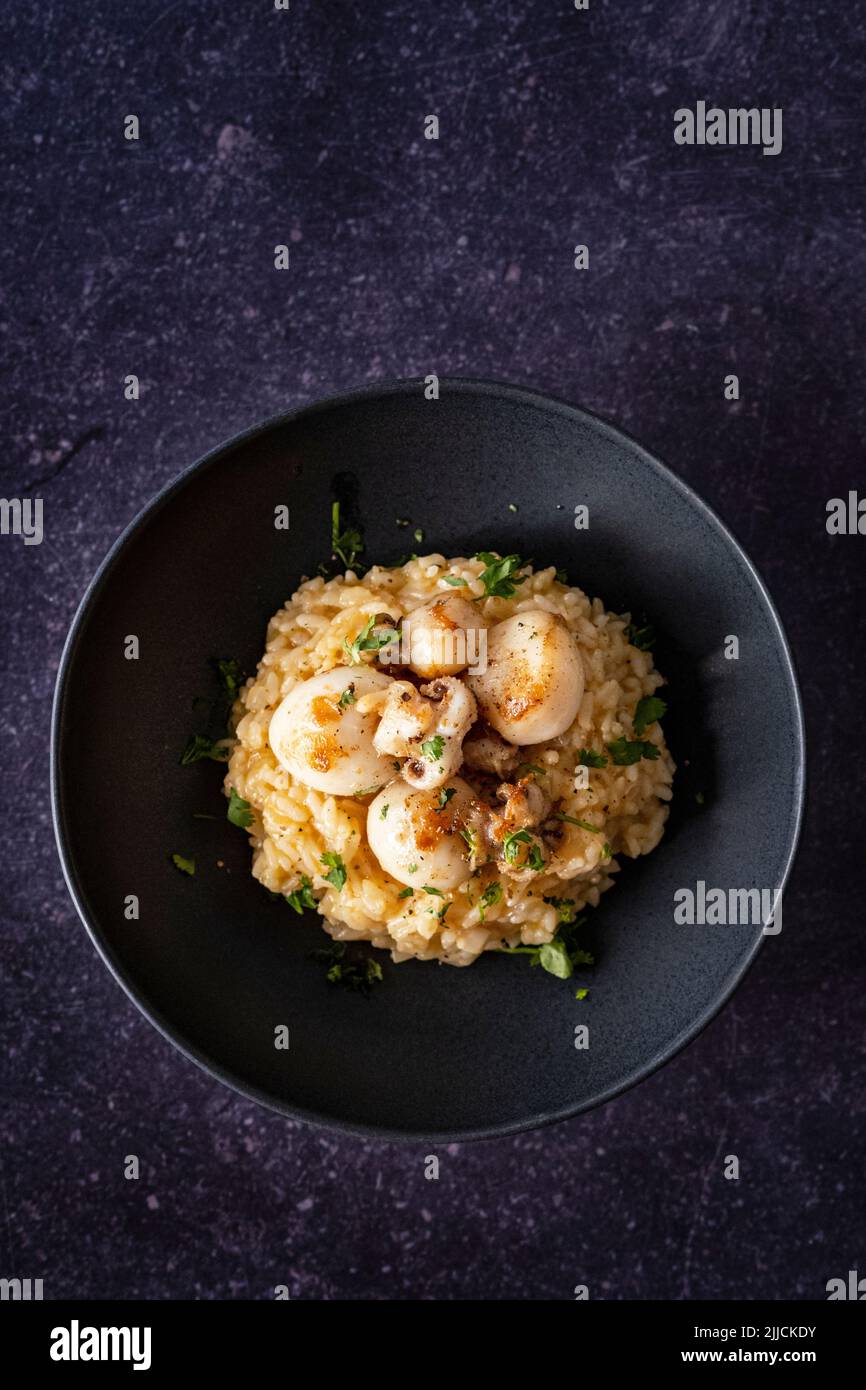 Cuttlefish risotto with garlic butter Stock Photo - Alamy