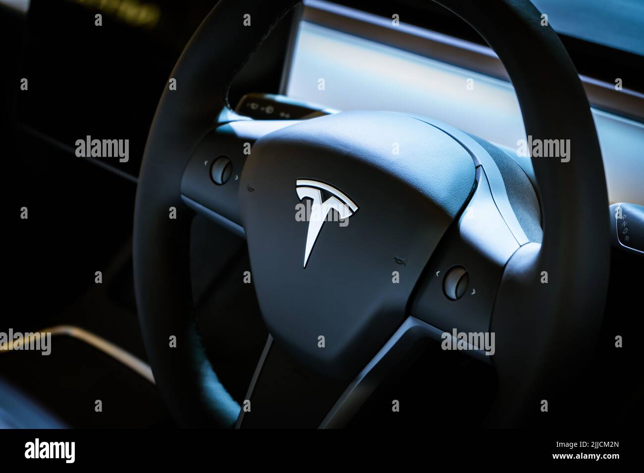 Singapore - July 19, 2022: Tesla logo on a steering wheel. Stock Photo