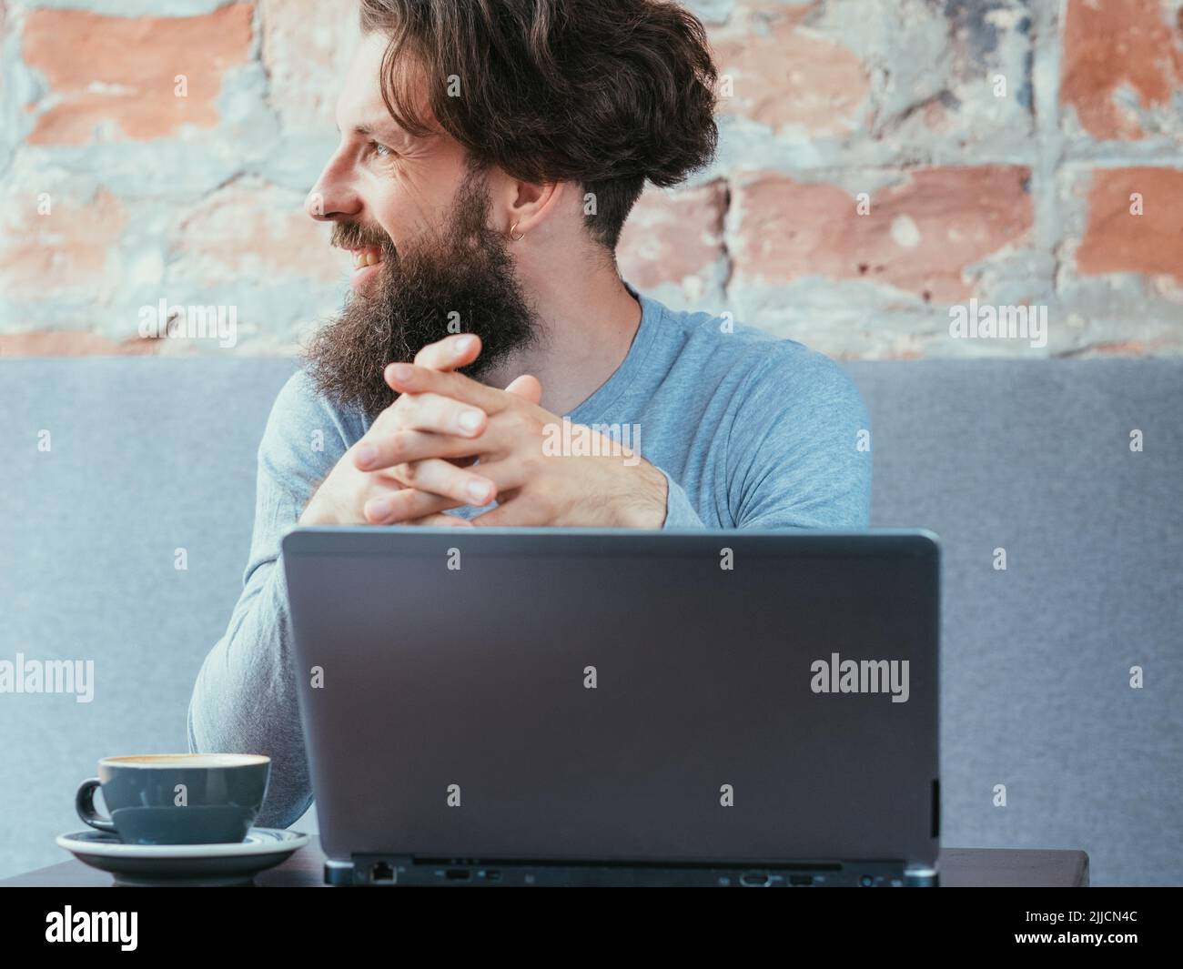 man cafe laptop coffee cup blogging social media Stock Photo