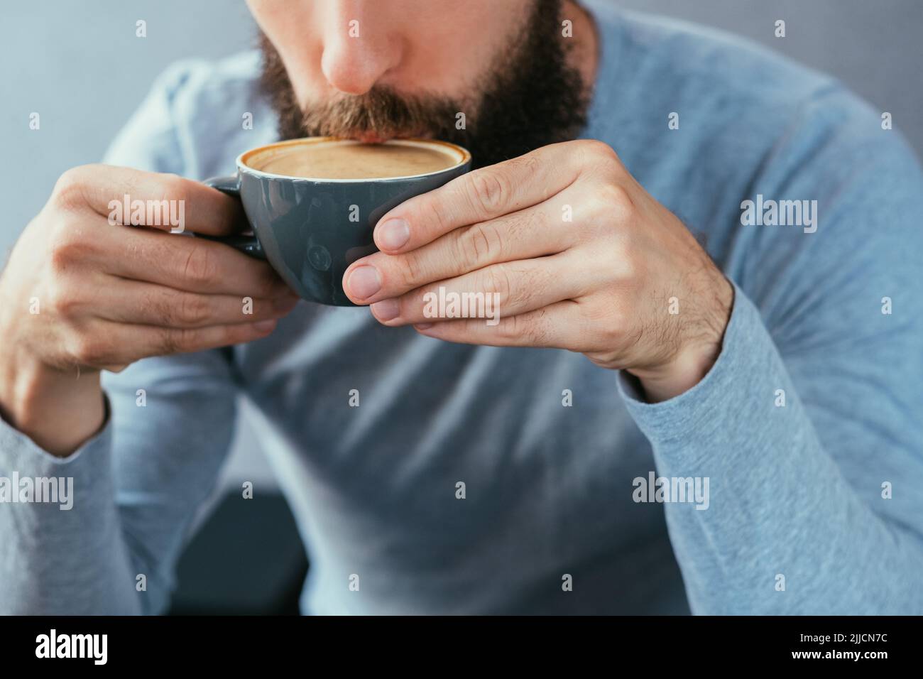 man drink coffee traditional hot cappuccino mug Stock Photo