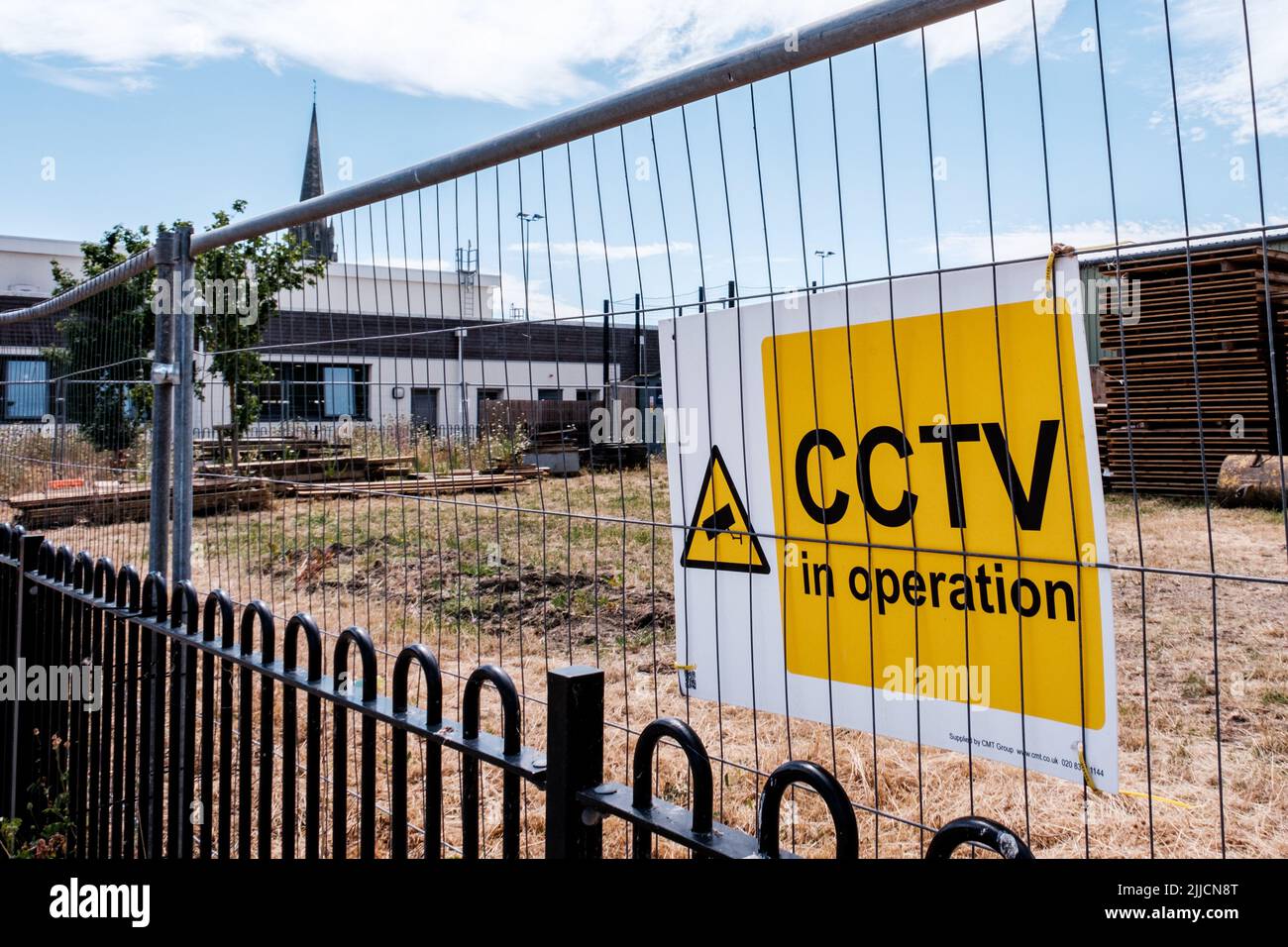Dorking Surrey Hills London UK, July 24 2022, Builders Material Storage Yard With Warning Signs And Security Fence Stock Photo