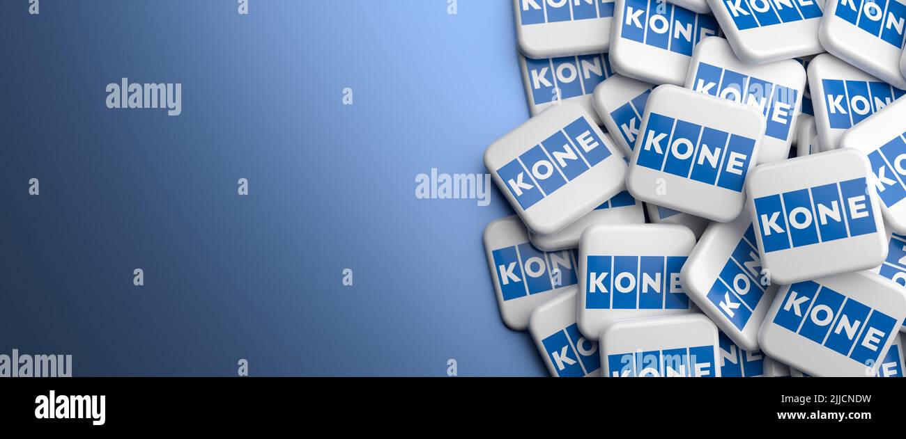 Logos of the Finnish elevator engineering and service company KONE on a heap on a table. Copy space. Web banner format. Stock Photo