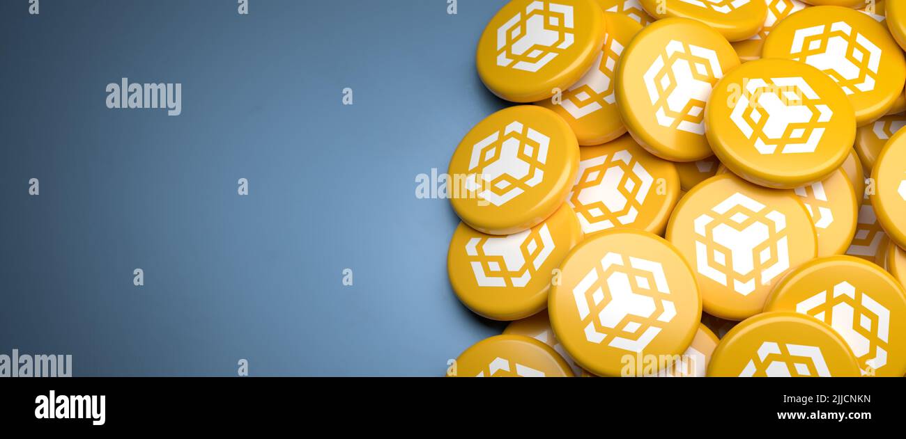 Logos of the cryptocurrency BNB coin (2022 version) on a heap on a table.  Copy space. Web banner format Stock Photo - Alamy