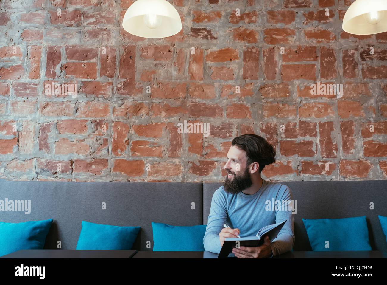 man writing notebook plan think idea visualization Stock Photo