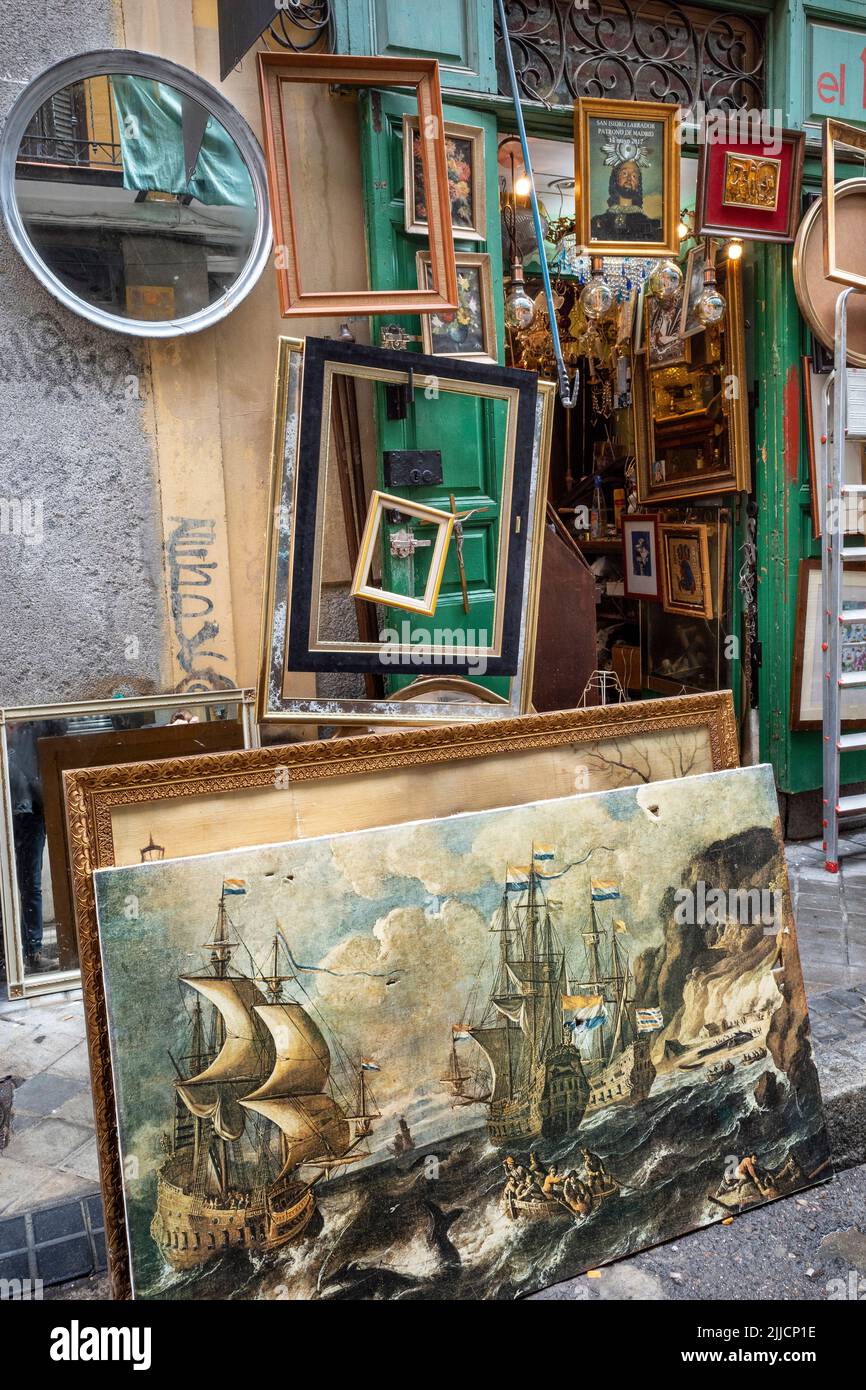 Pictures and picture frames on sale in the Rastro flea market around the Plaza de Cascorro between La Latina and Embajadores,  Madrid, Spain. Stock Photo