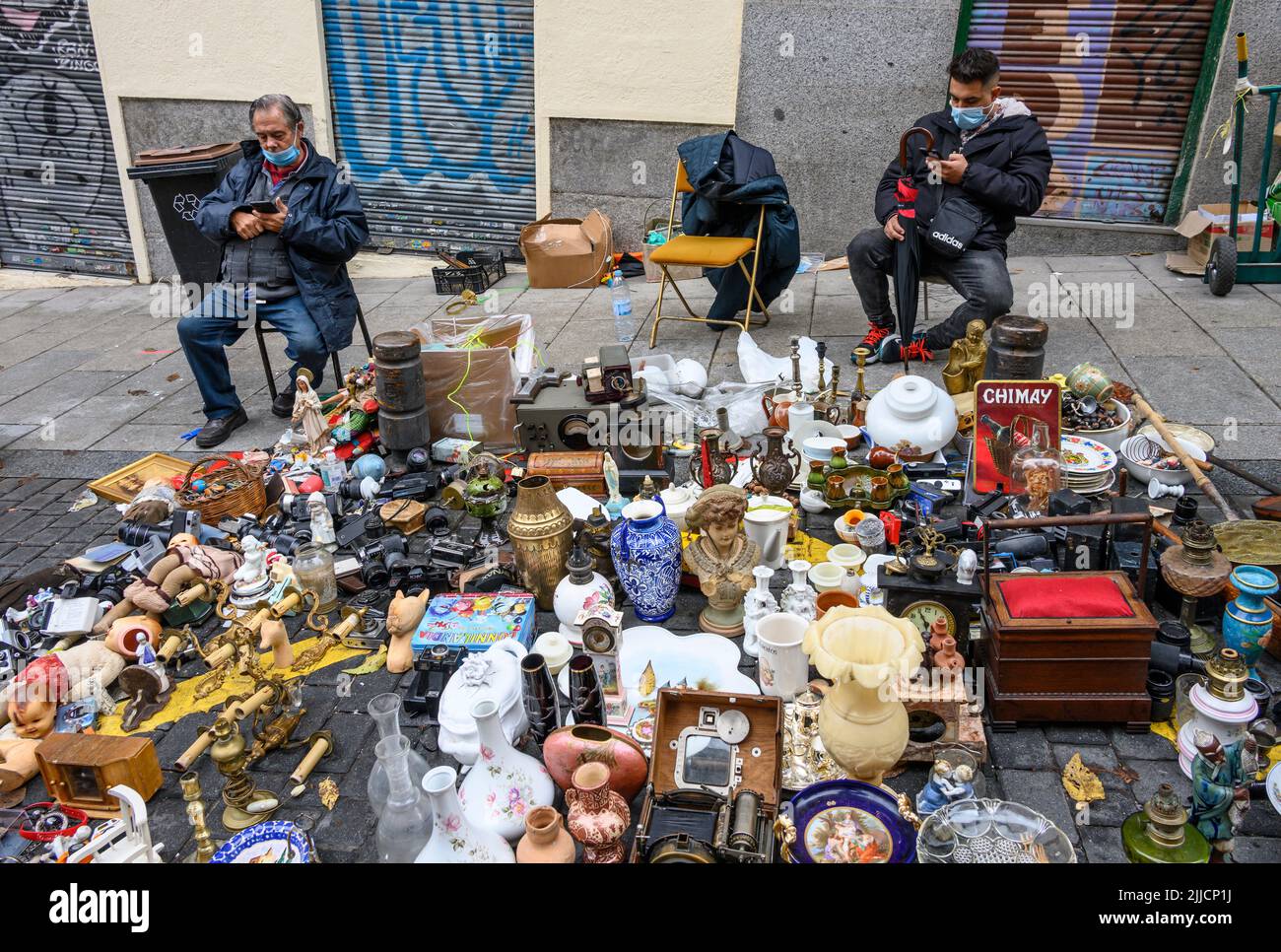 Antiques and bric-a-brac on sale in the Rastro flea market around the Plaza de Cascorro between La Latina and Embajadores,  Madrid, Spain. Stock Photo