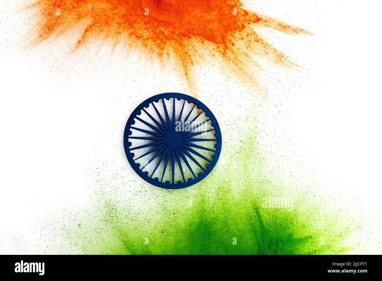 Orange and green color powder splash with Ashoka wheel. Concept for India independence day, 15th of august Stock Photo
