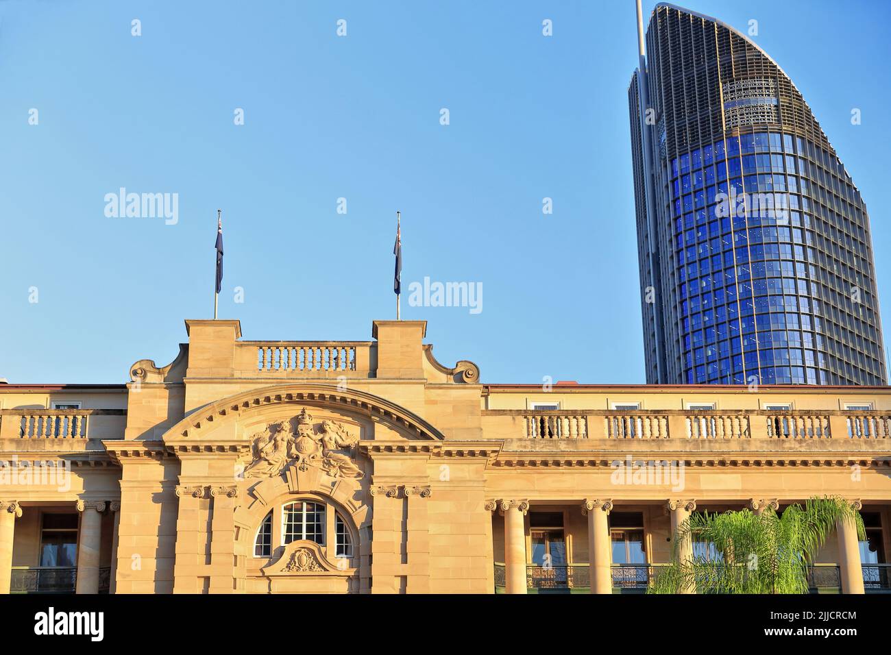 099 Ancient Land Administration heritage building backed by a State Government administrative skyscraper. Brisbane-Australia. Stock Photo