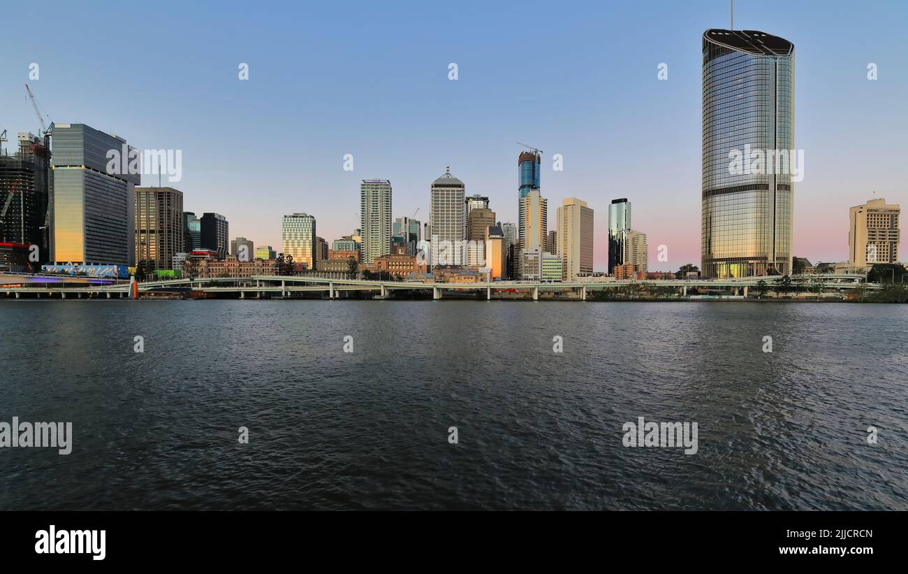 100 Skyscrapers at sunset seen from across the river. Brisbane CBD-Australia. Stock Photo