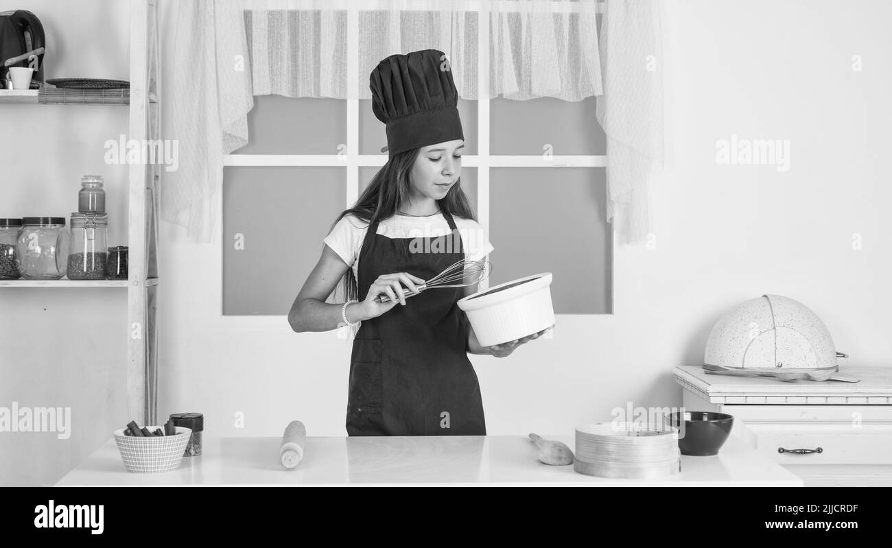 child beating with beater, kitchen utensil Stock Photo Alamy