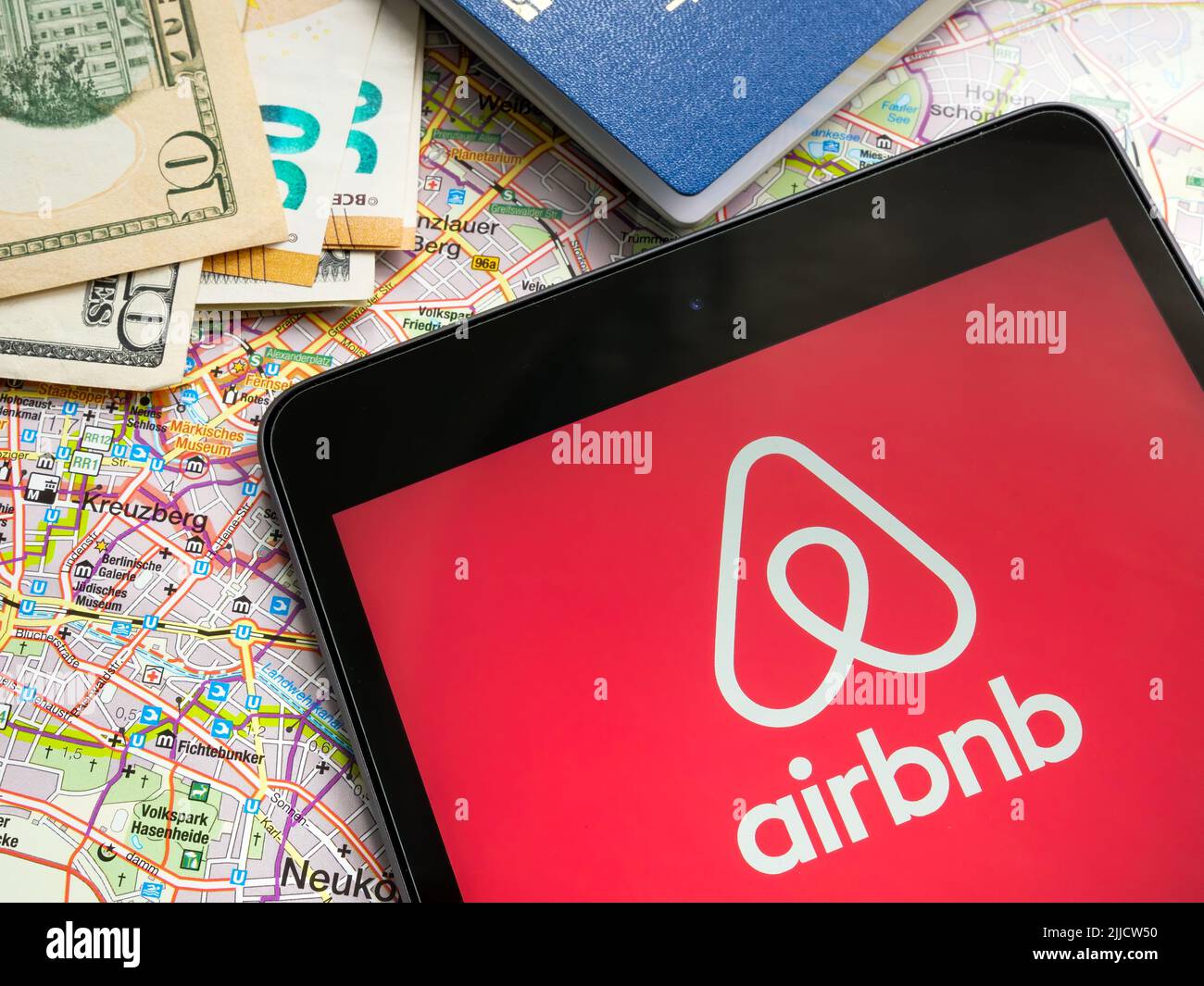 KYIV, UKRAINE - July 21, 2022. Tablet with Airbnb logo and a map. Stock Photo