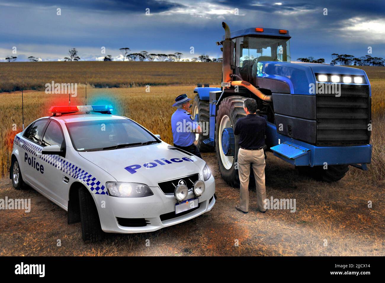 Western Australia Police (WAPOL) Rural / Country Police in action on a farm with a Combine Harvester. Stock Photo