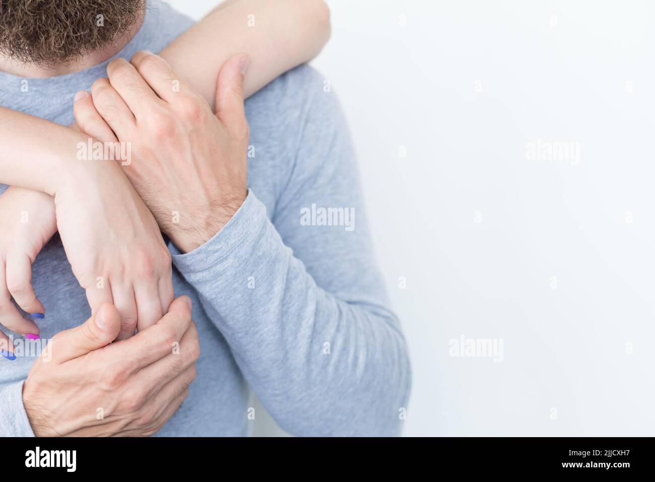love bond togetherness couple hug hands entwined Stock Photo