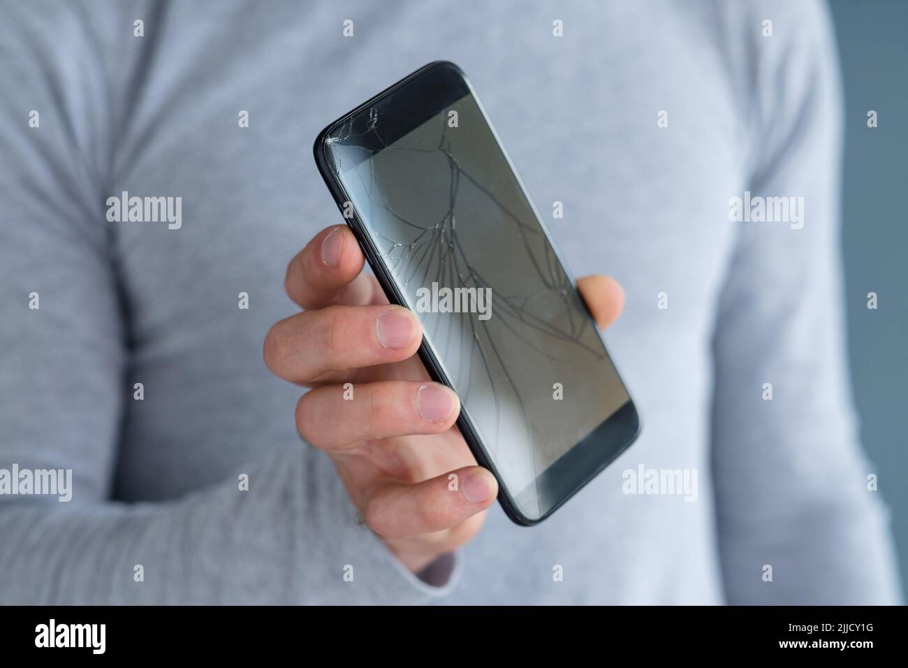 cracked screen mobile device phone repair Stock Photo