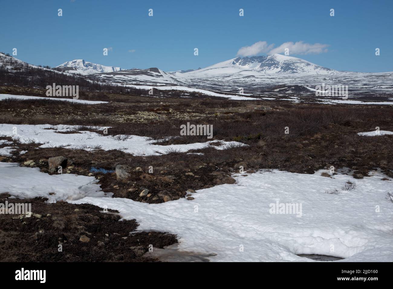 Snøhetta is with 2286 meter above sea level the highest peak in Dovrefjell which is a mountain range and highland in central Norway. Stock Photo